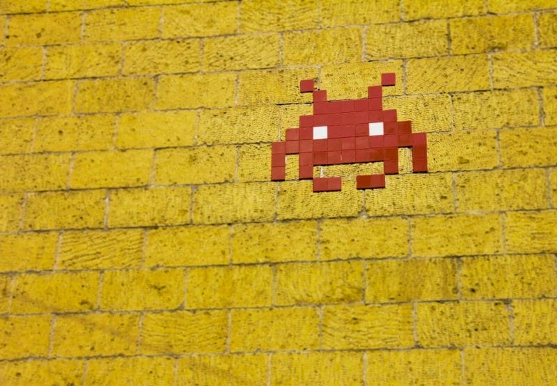 An Image Showing The Alien From Space Invaders On A Wall